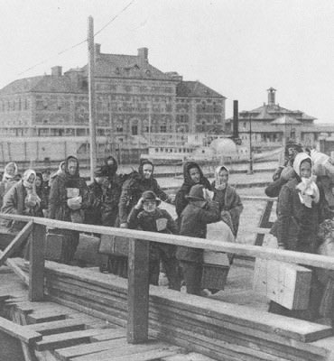 Black and white photo of immigrants arriving